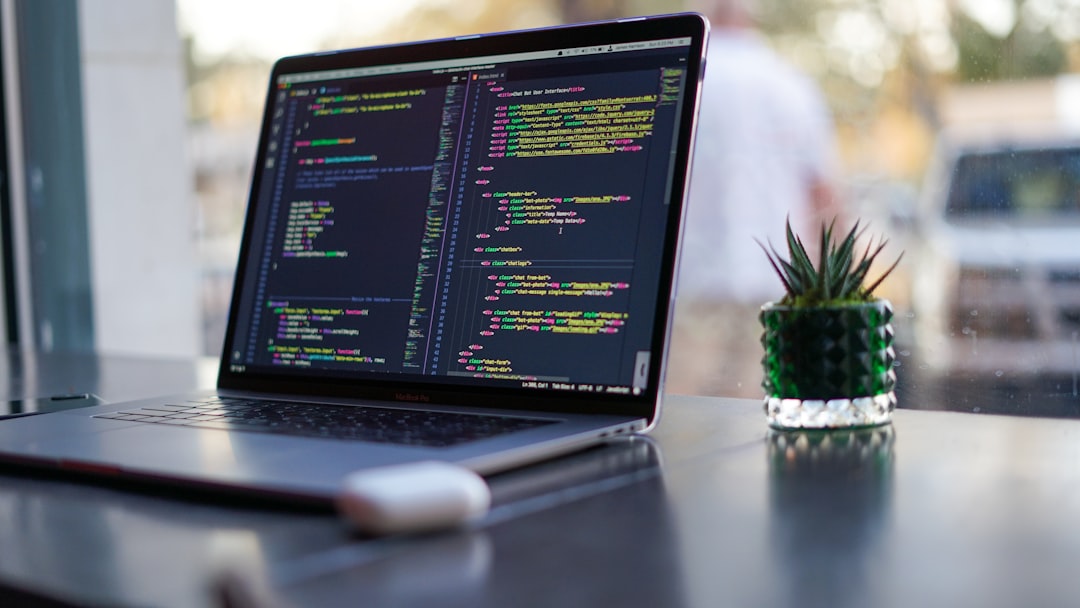 why-choose-us-02 Laptop with code and plant in coffee shop
